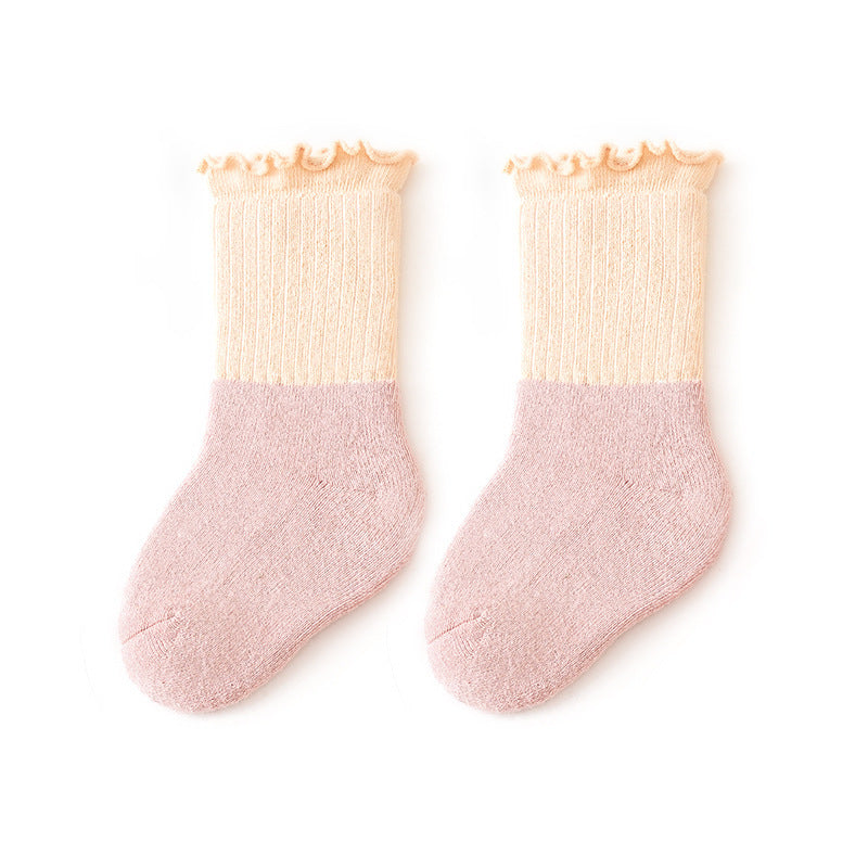 Baby unisex ruffle fringe crew socks in colorful patchwork design made of soft cotton blend