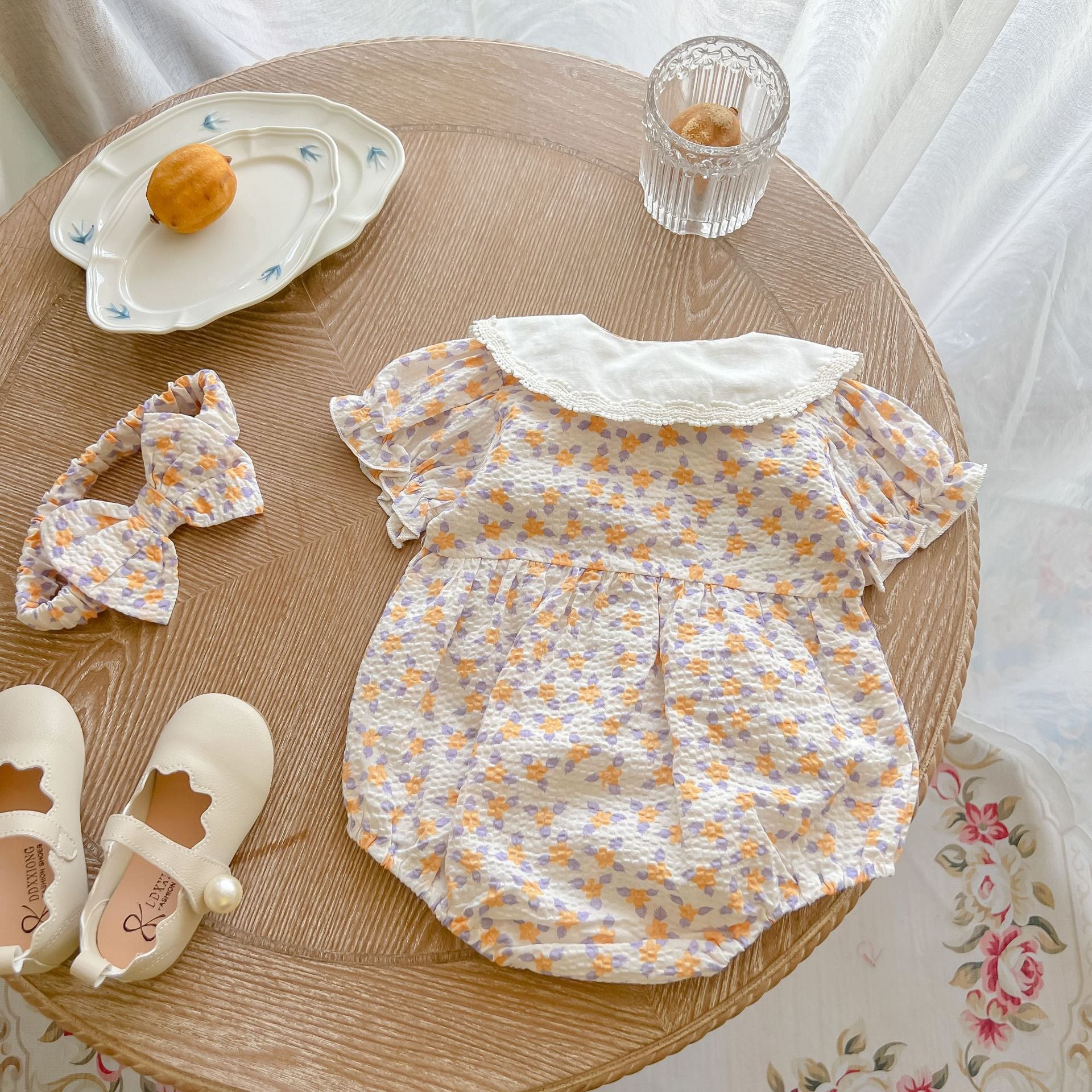 Yellow floral print baby girl bodysuit with an embroidered doll collar made of soft cotton — view 2