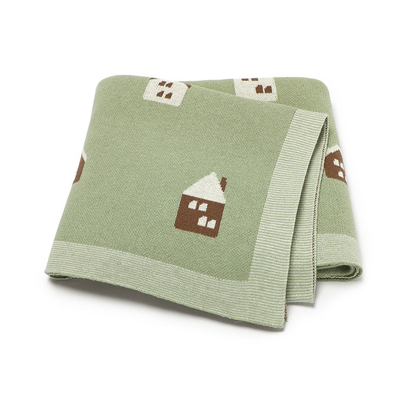 Soft cotton knitted baby blanket featuring a charming little house pattern for newborn nursery decor