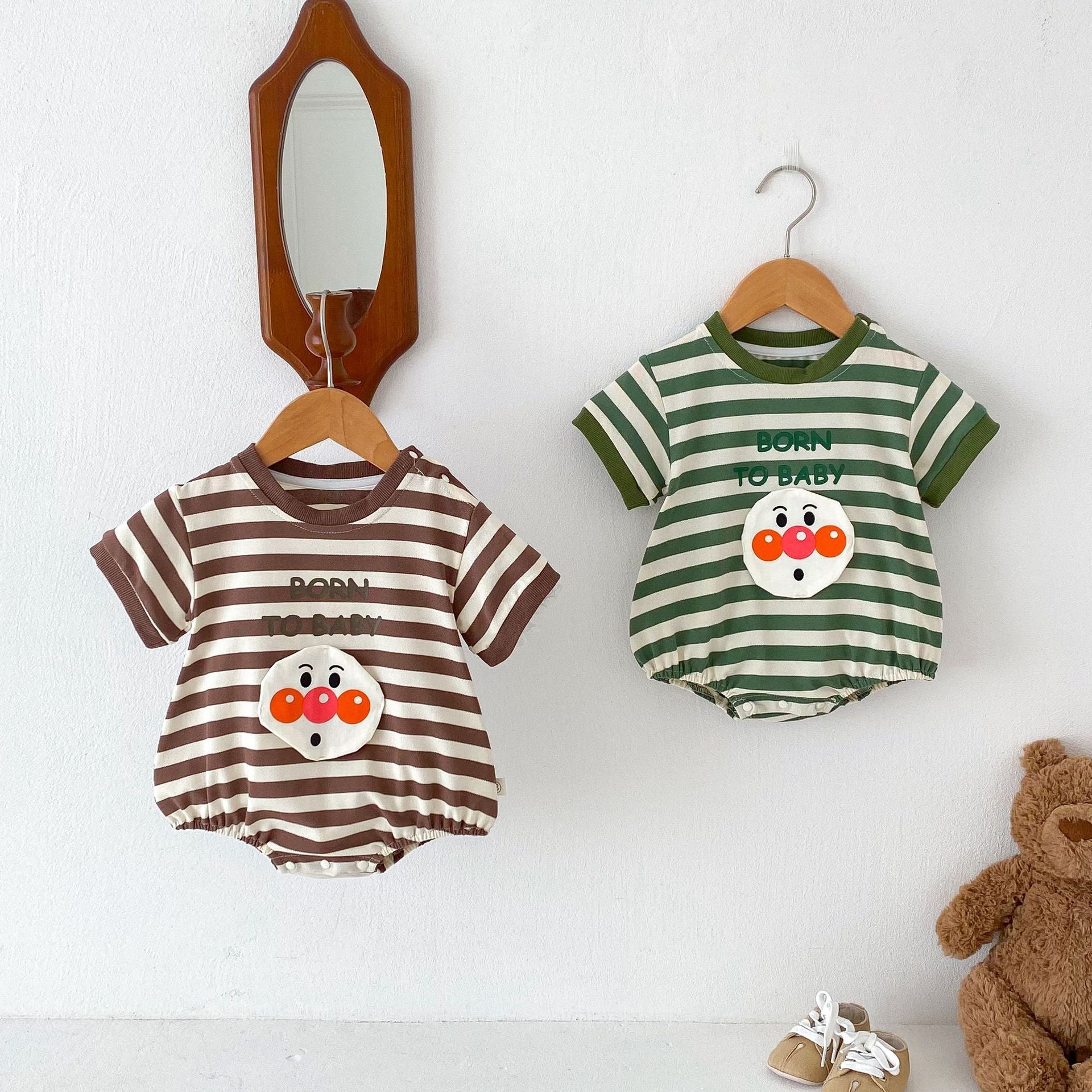 Unisex striped baby bodysuit with playful joker pattern short sleeves and soft breathable cotton fabric