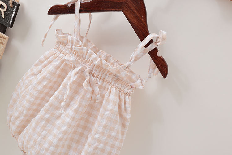 Baby girl beige plaid bodysuit in soft cotton featuring sleeveless design and cute bow tie detail — view 2