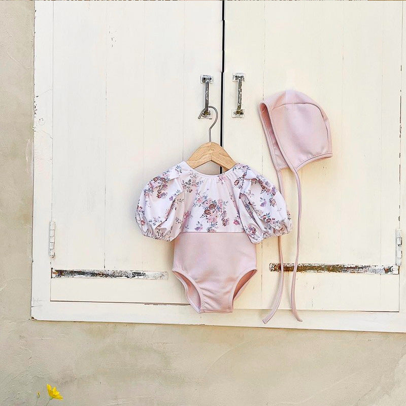 Baby girl pink floral swimwear set with puff sleeves and matching sun protection hat — view 3