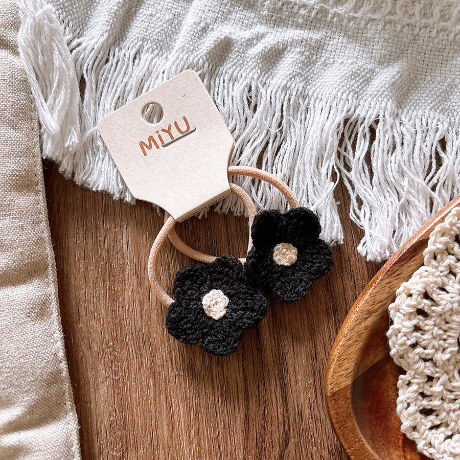 Knitted flower baby hair clips in soft cloth material for taming delicate stray hairs — view 3