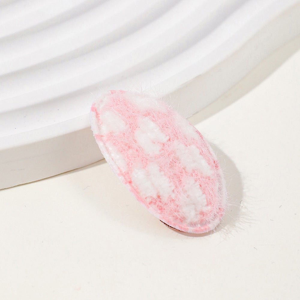 Baby fabric hair clip with cute dotted corn kernel print in soft pastel colors. — view 2