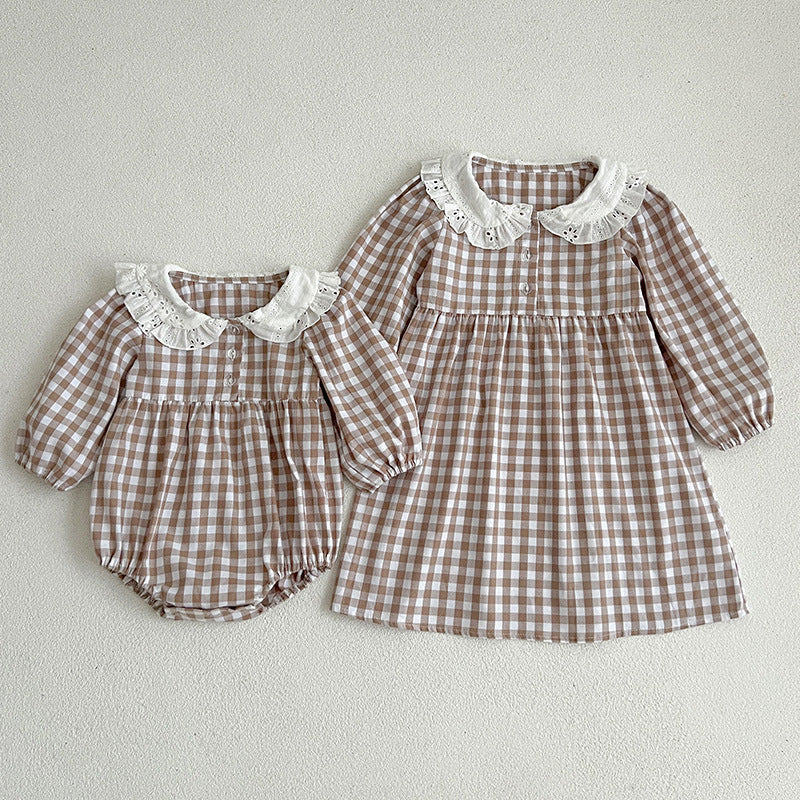 Plaid doll neck baby bodysuit in brown and white cotton with cozy long sleeves. — view 2