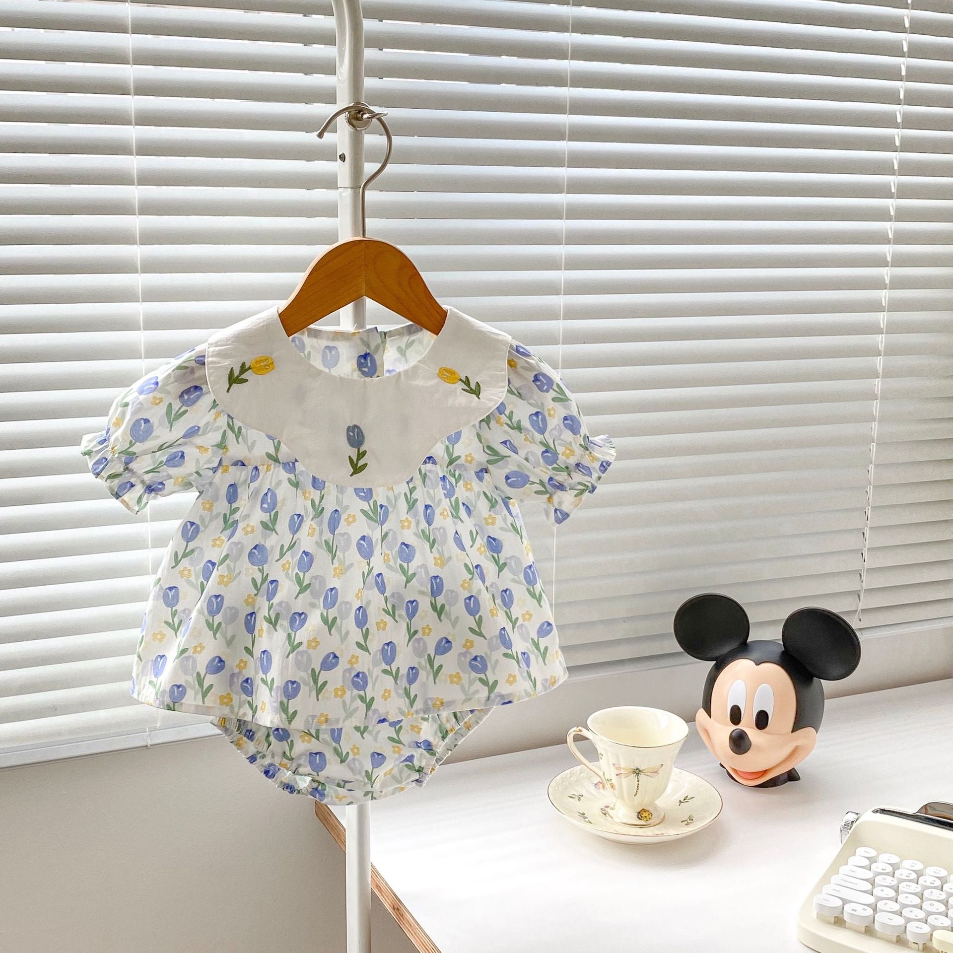 Blue cotton baby clothing set with floral embroidered doll neck top and matching shorts — view 3