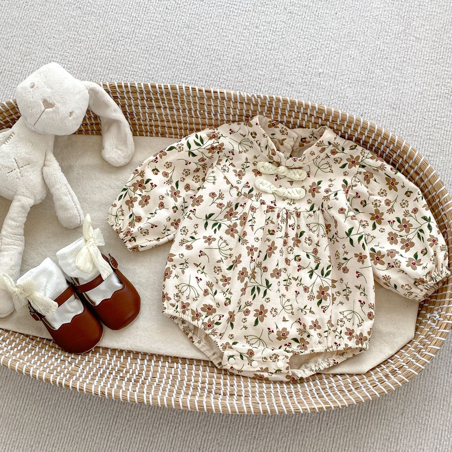 Brown long-sleeve cotton baby bodysuit with vibrant autumn floral pattern and traditional Chinese style details. — view 2