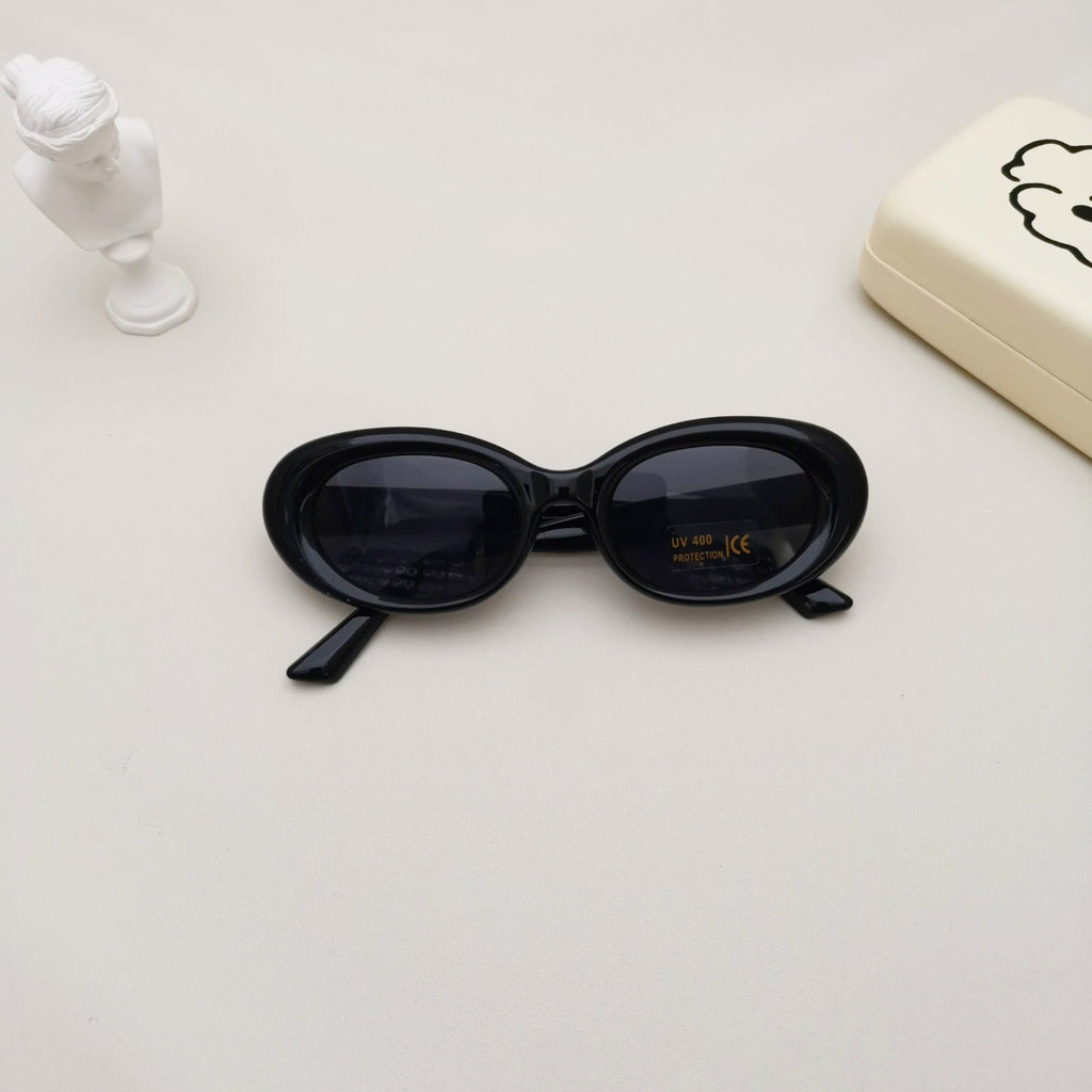 Kids oval beach sunglasses in solid colors featuring lightweight polycarbonate frames and UV protective lenses — view 2