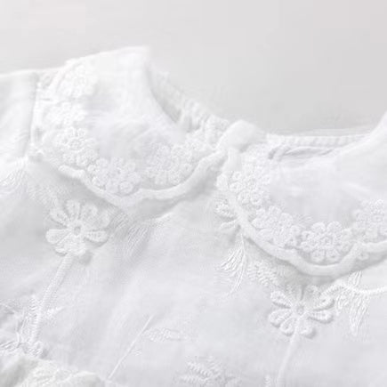White baby girl bodysuit dress with floral embroidery, doll neck collar, and long sleeves in cotton — view 3