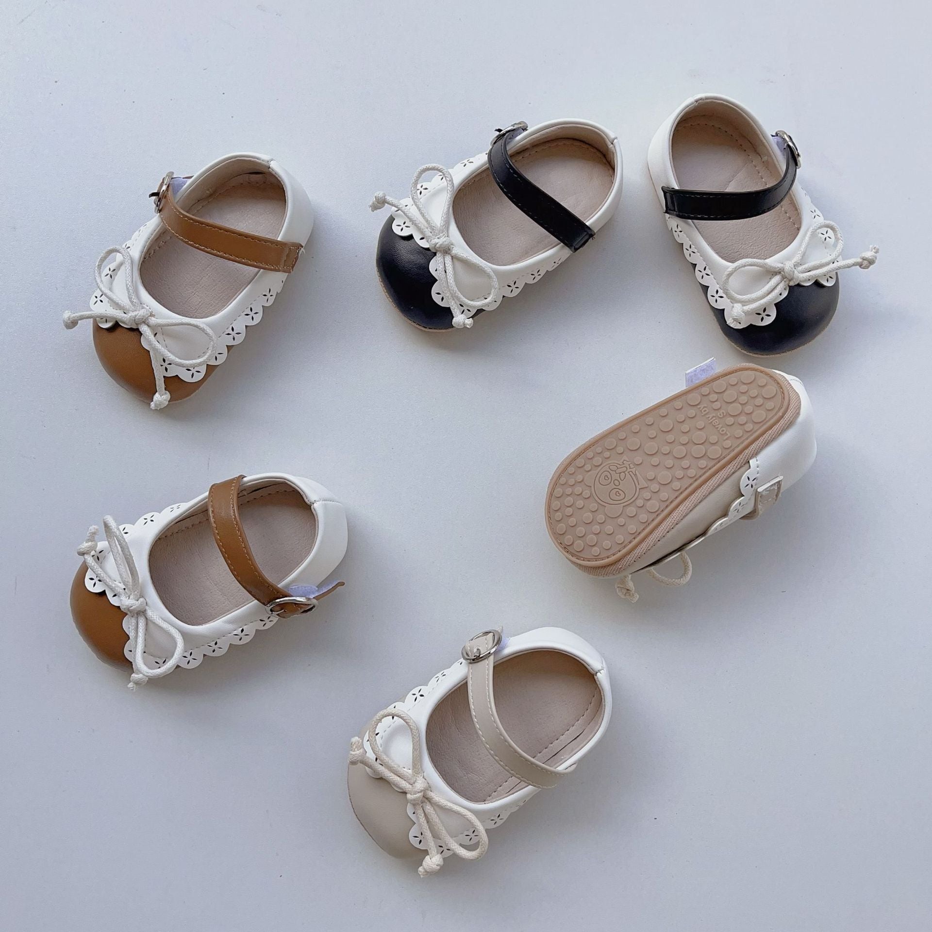 Toddler girl soft sole walking shoes in white with shoelace bow and anti-slip grip — view 3