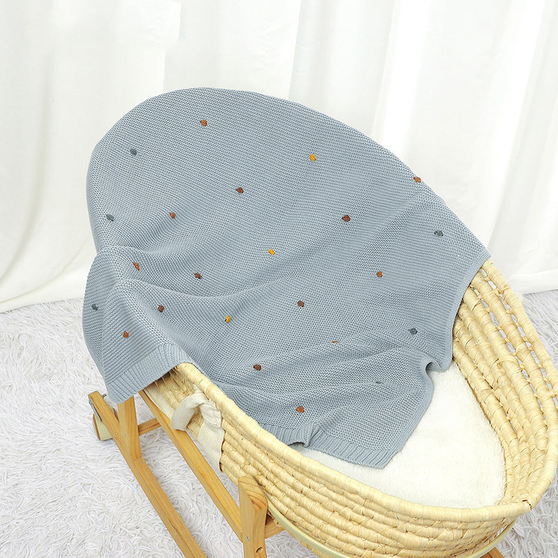 Knitted cotton baby blanket with hand-embroidered pom poms, in soft solid colors for contemporary nurseries. — view 2