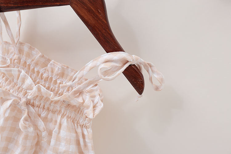 Baby girl beige plaid bodysuit in soft cotton featuring sleeveless design and cute bow tie detail — view 3