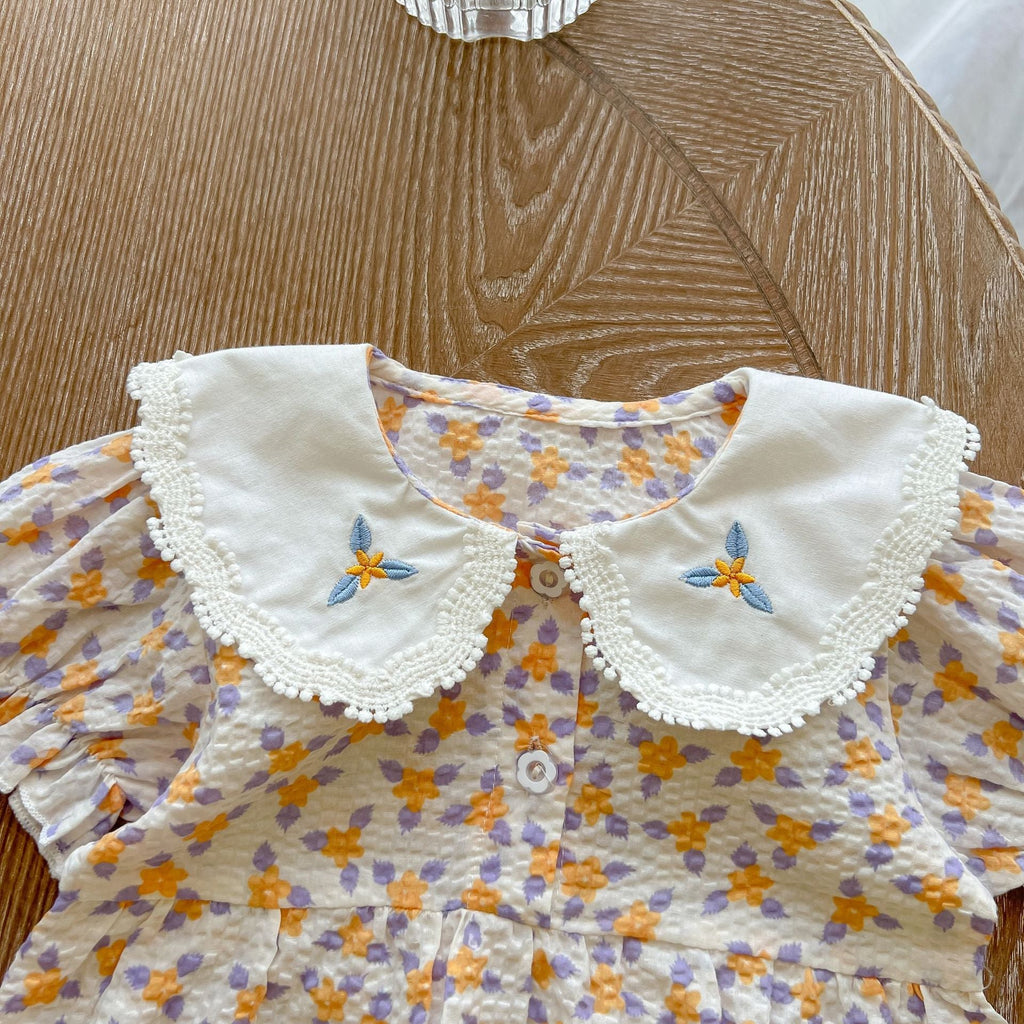 Yellow floral print baby girl bodysuit with an embroidered doll collar made of soft cotton — view 3