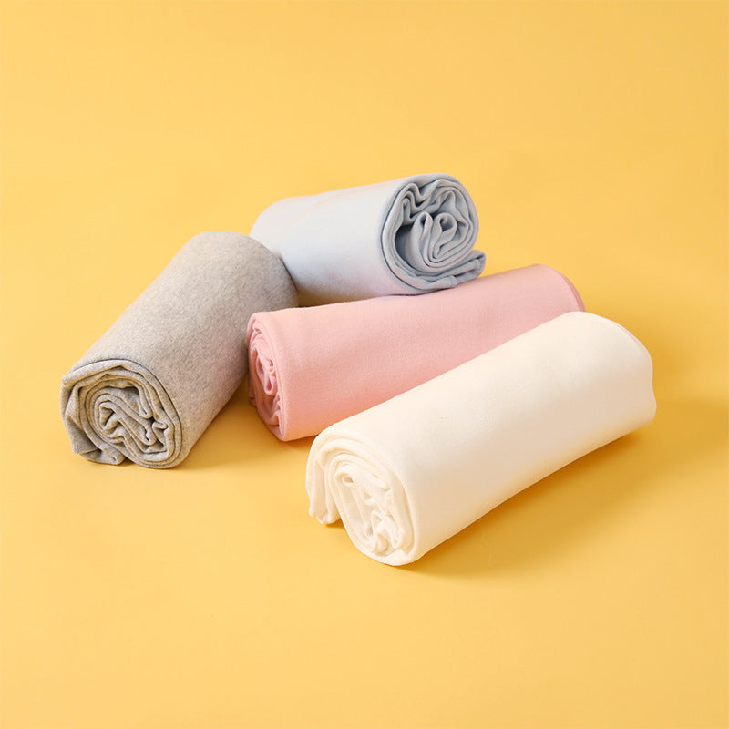 Newborn cotton wrap quilt in solid color, soft baby blanket neatly folded for cozy nursery. — view 2