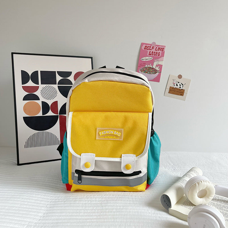 Preschool canvas backpack for children featuring a colorful patchwork design and spacious main storage compartment — view 2