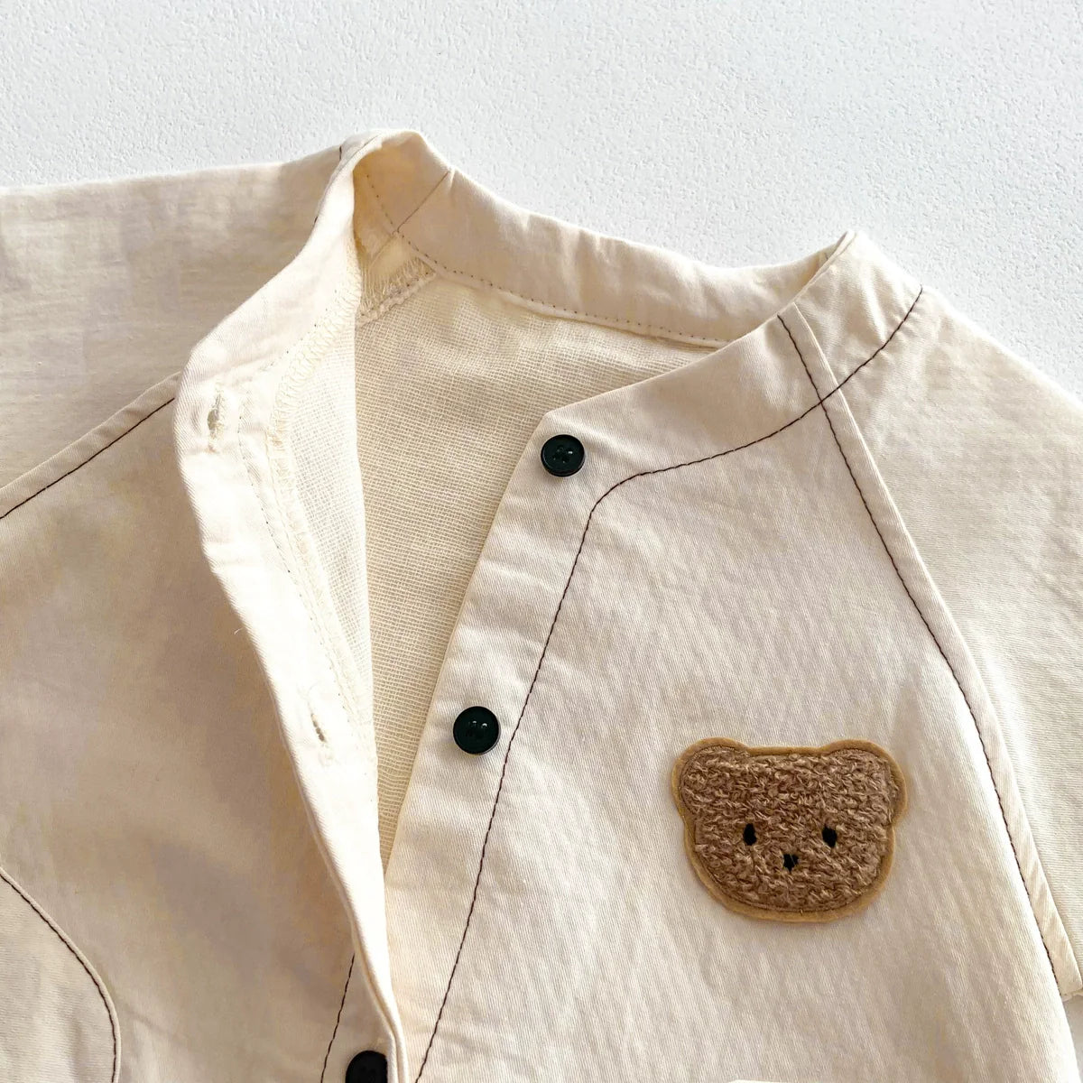 Short sleeve unisex baby teddy bear romper in soft cotton with a single breasted front closure — view 4