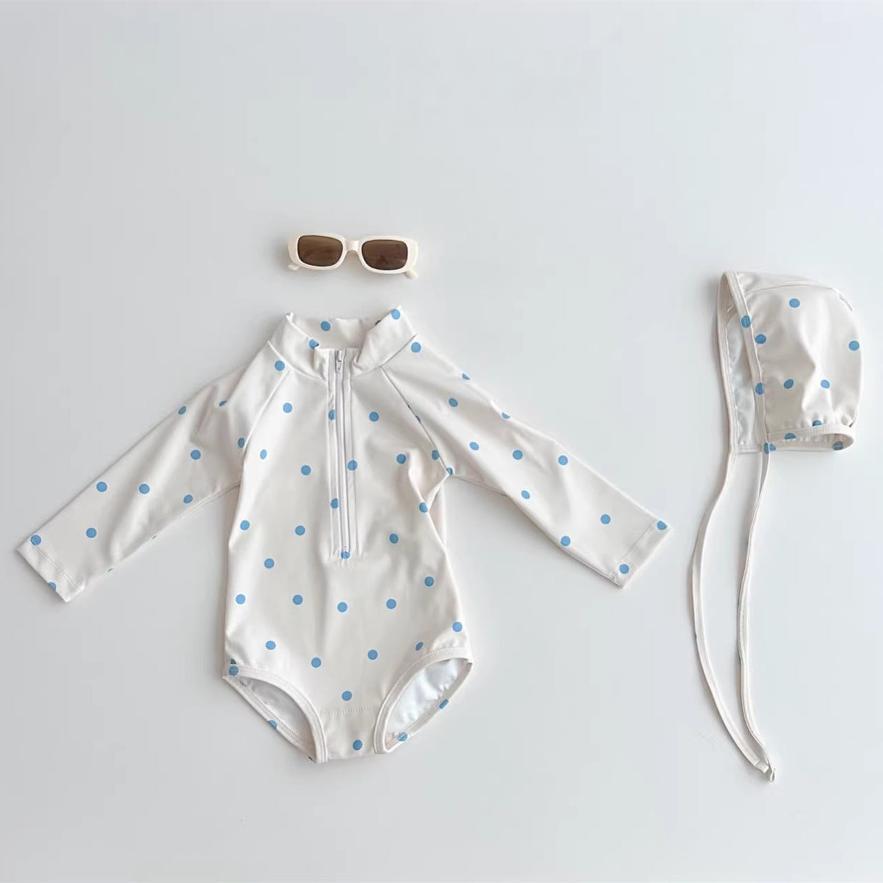Kids long-sleeve rash guard swimsuit and matching swim cap in blue plaid and polka dots — view 2