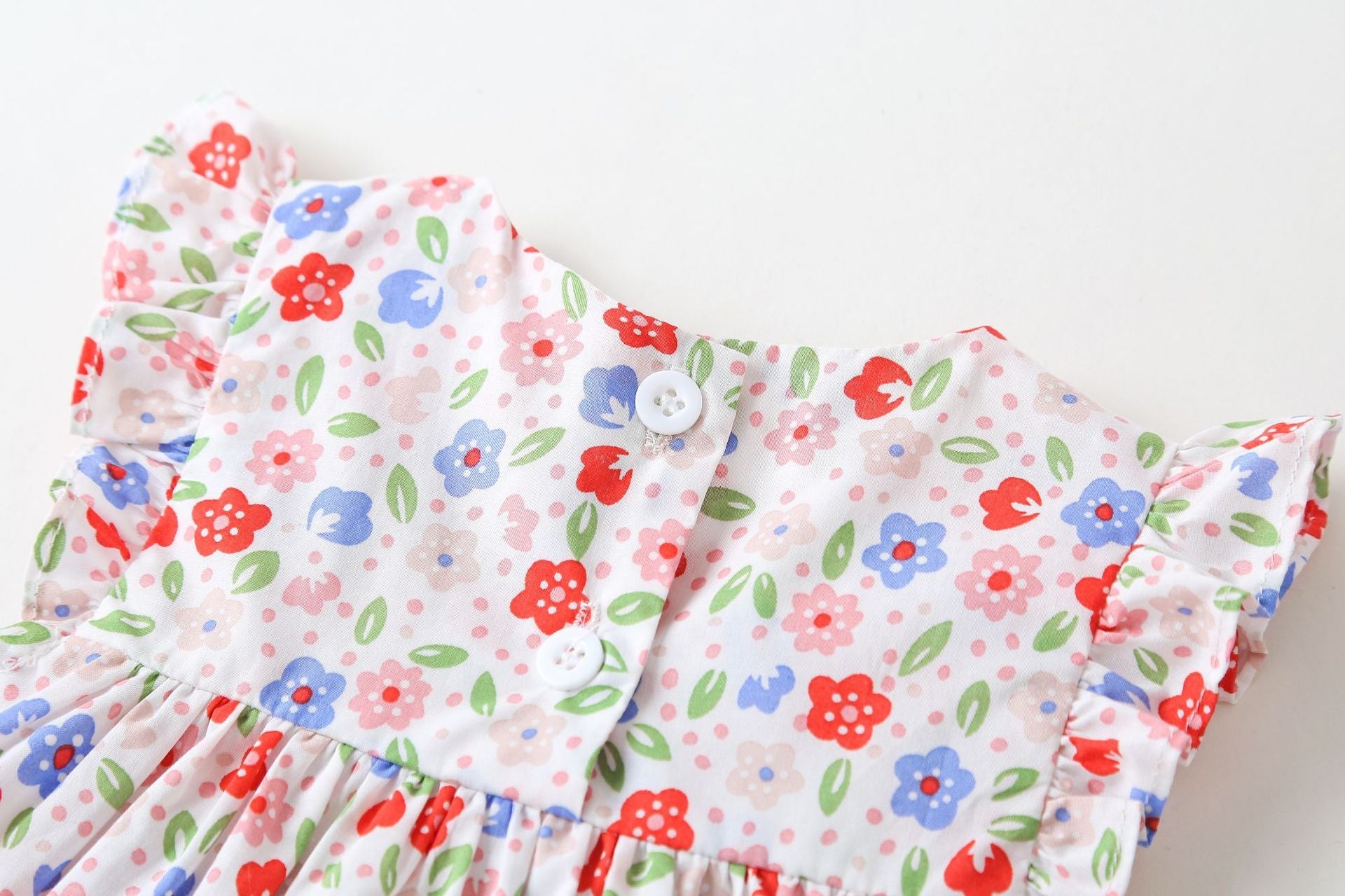 Pink floral baby girl sleeveless bodysuit dress with bow tie detail and round collar — view 4