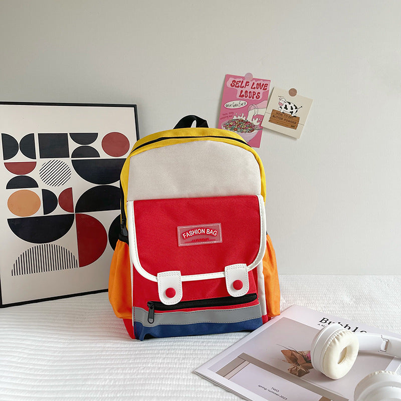 Preschool canvas backpack for children featuring a colorful patchwork design and spacious main storage compartment — view 3