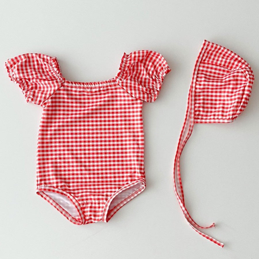 Red and blue plaid polka dot two-piece baby girl swimsuit with matching sun protection hat — view 3