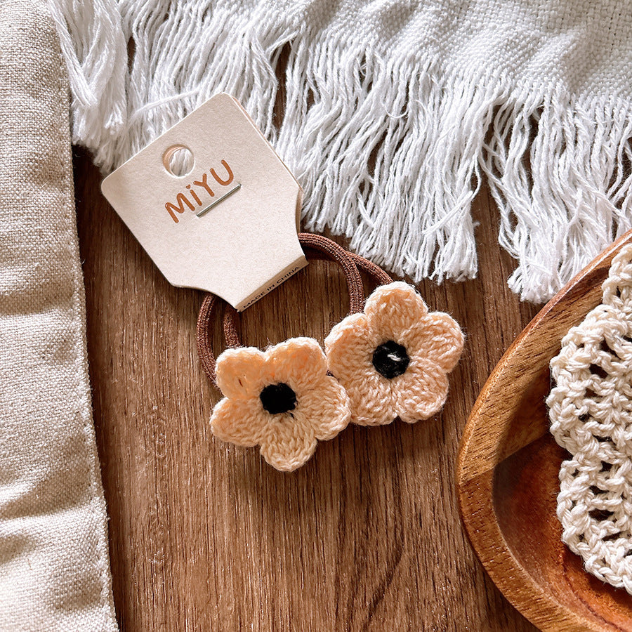 Knitted flower baby hair clips in soft cloth material for taming delicate stray hairs — view 4