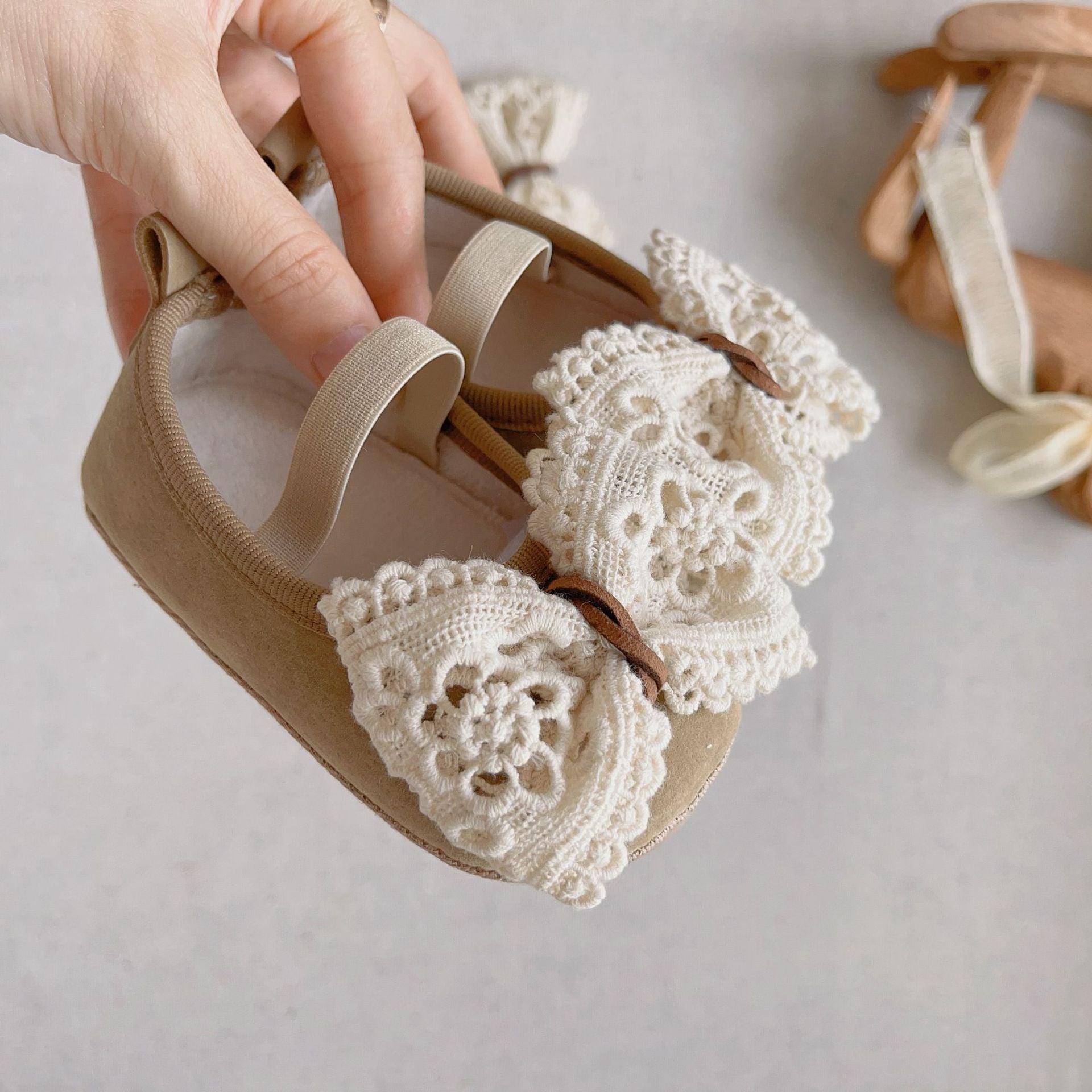 Beige and coffee baby girl toddler walking shoes with a sweet bow and hollow-out design — view 3