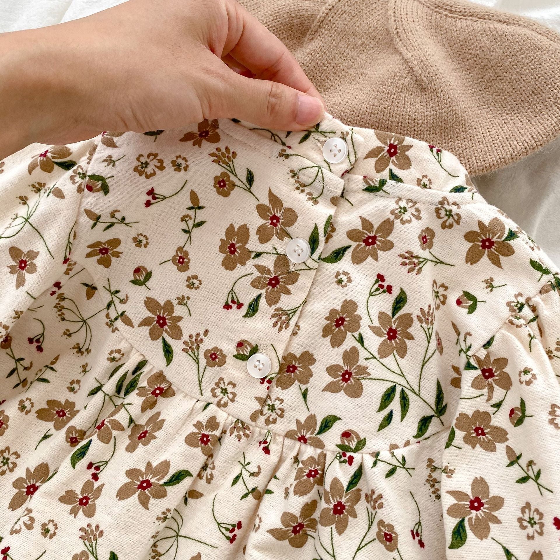 Brown long-sleeve cotton baby bodysuit with vibrant autumn floral pattern and traditional Chinese style details. — view 3