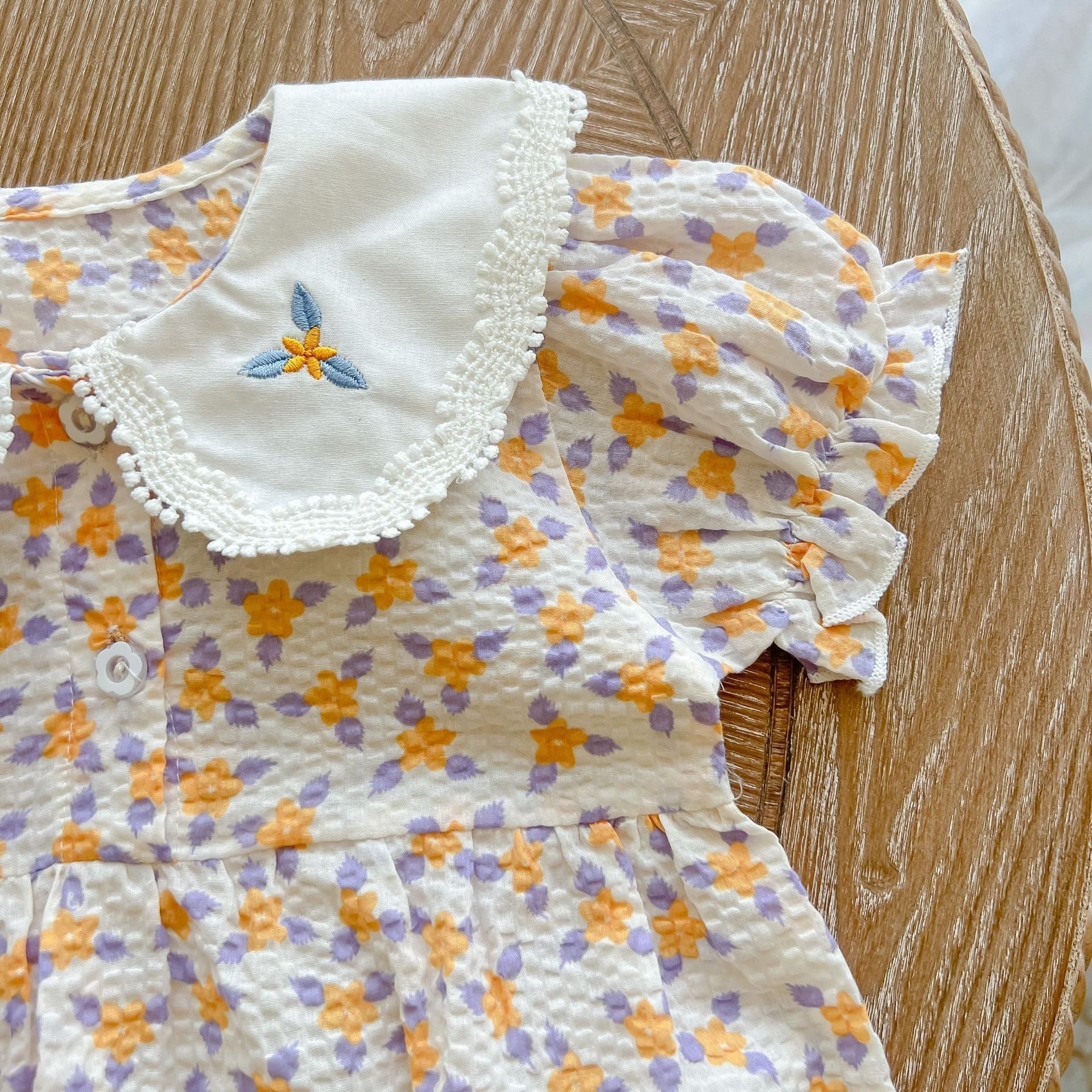 Yellow floral print baby girl bodysuit with an embroidered doll collar made of soft cotton — view 4