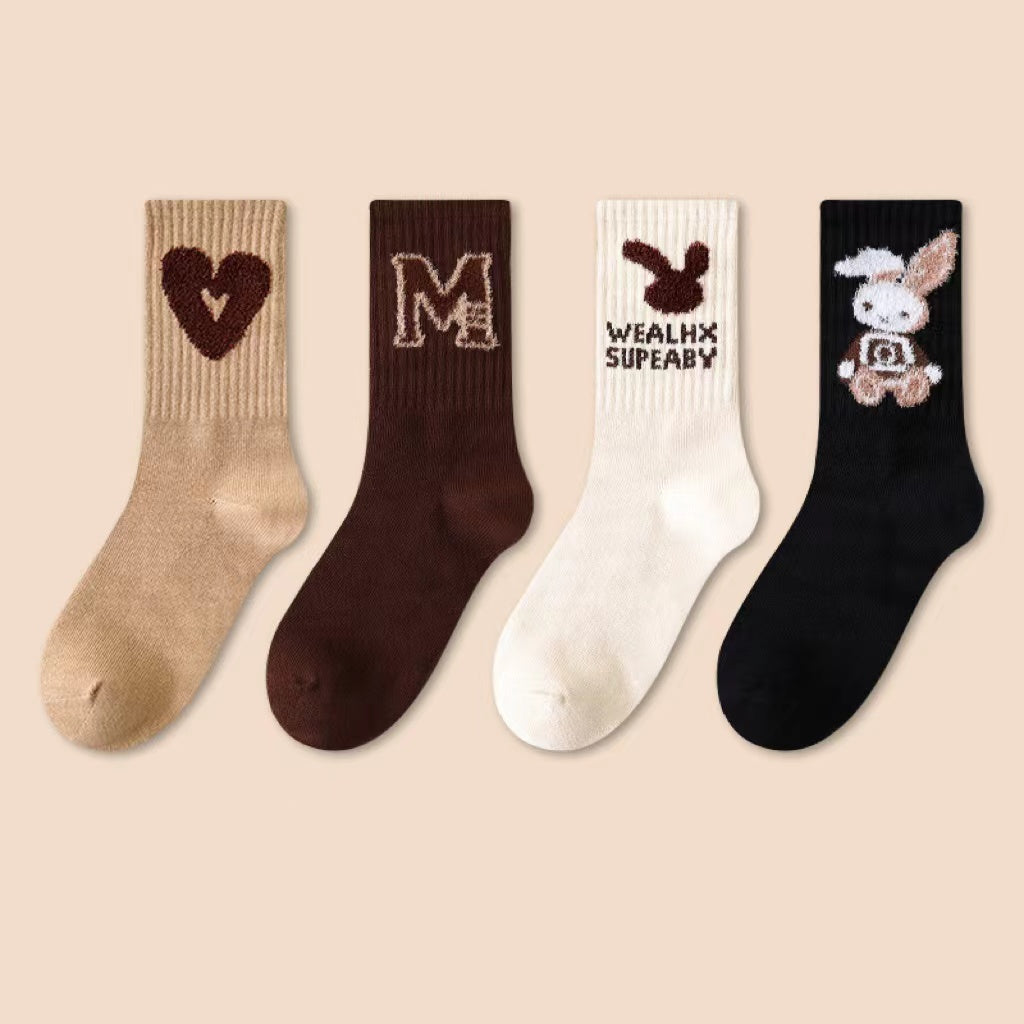 Four pairs of kids soft cotton mid-tube socks in black, apricot, brown, and coffee cartoon patterns — view 4