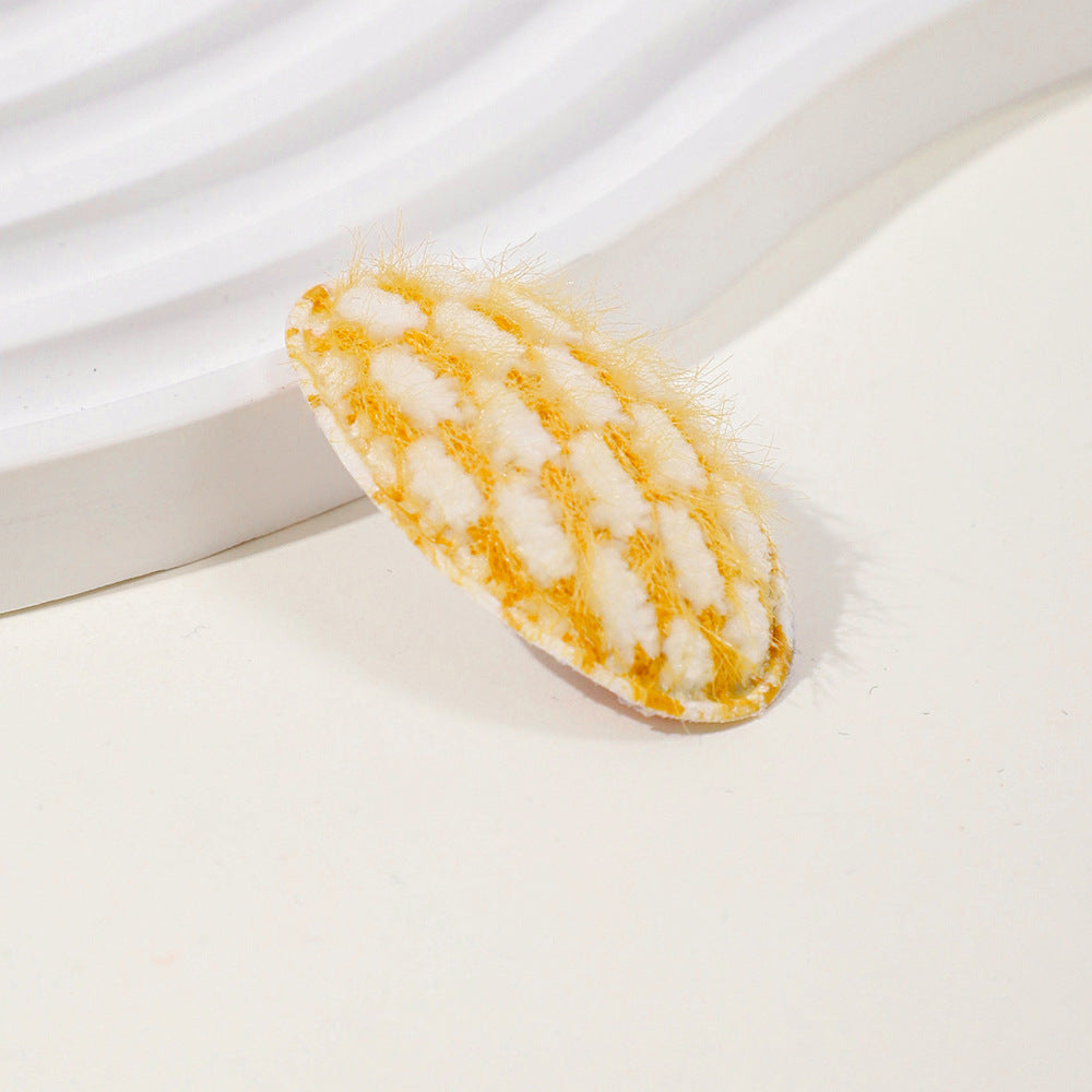 Baby fabric hair clip with cute dotted corn kernel print in soft pastel colors. — view 3