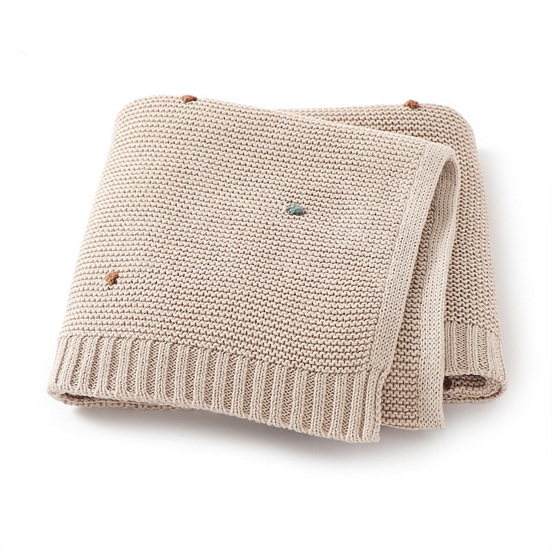 Knitted cotton baby blanket with hand-embroidered pom poms, in soft solid colors for contemporary nurseries. — view 3