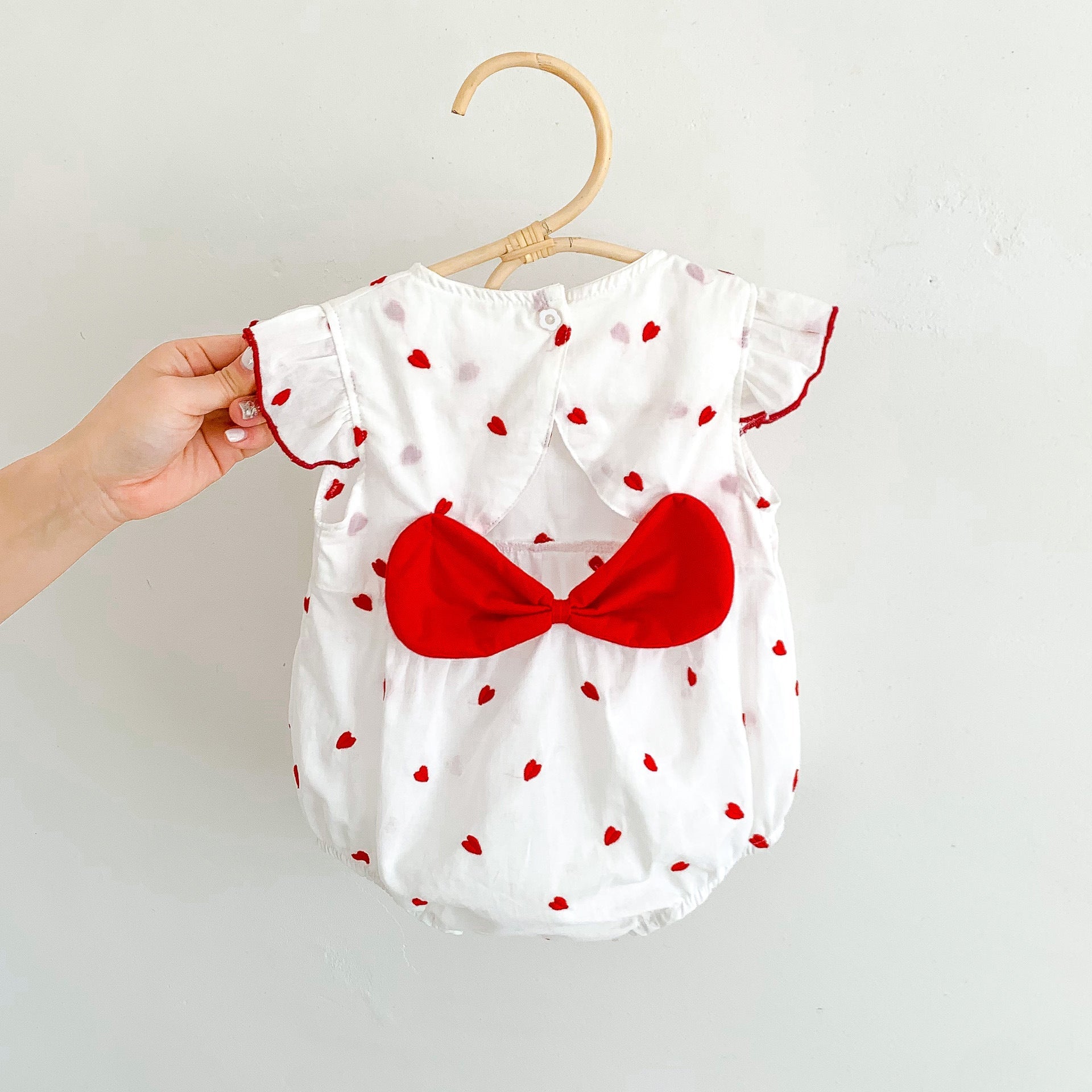 Baby girls beige summer bodysuit featuring a red heart print and delicate flutter fly sleeves. — view 4