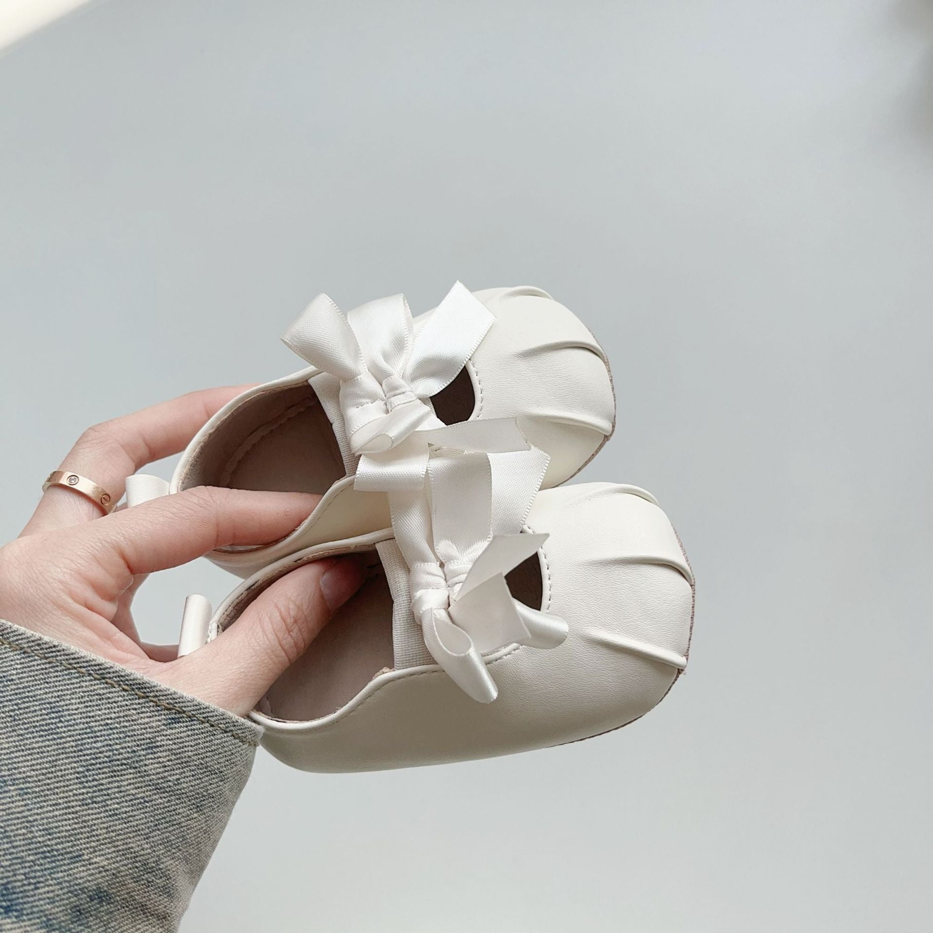 Baby girl polyurethane walking shoes featuring a butterfly bow pattern and anti slip bottom grips — view 3
