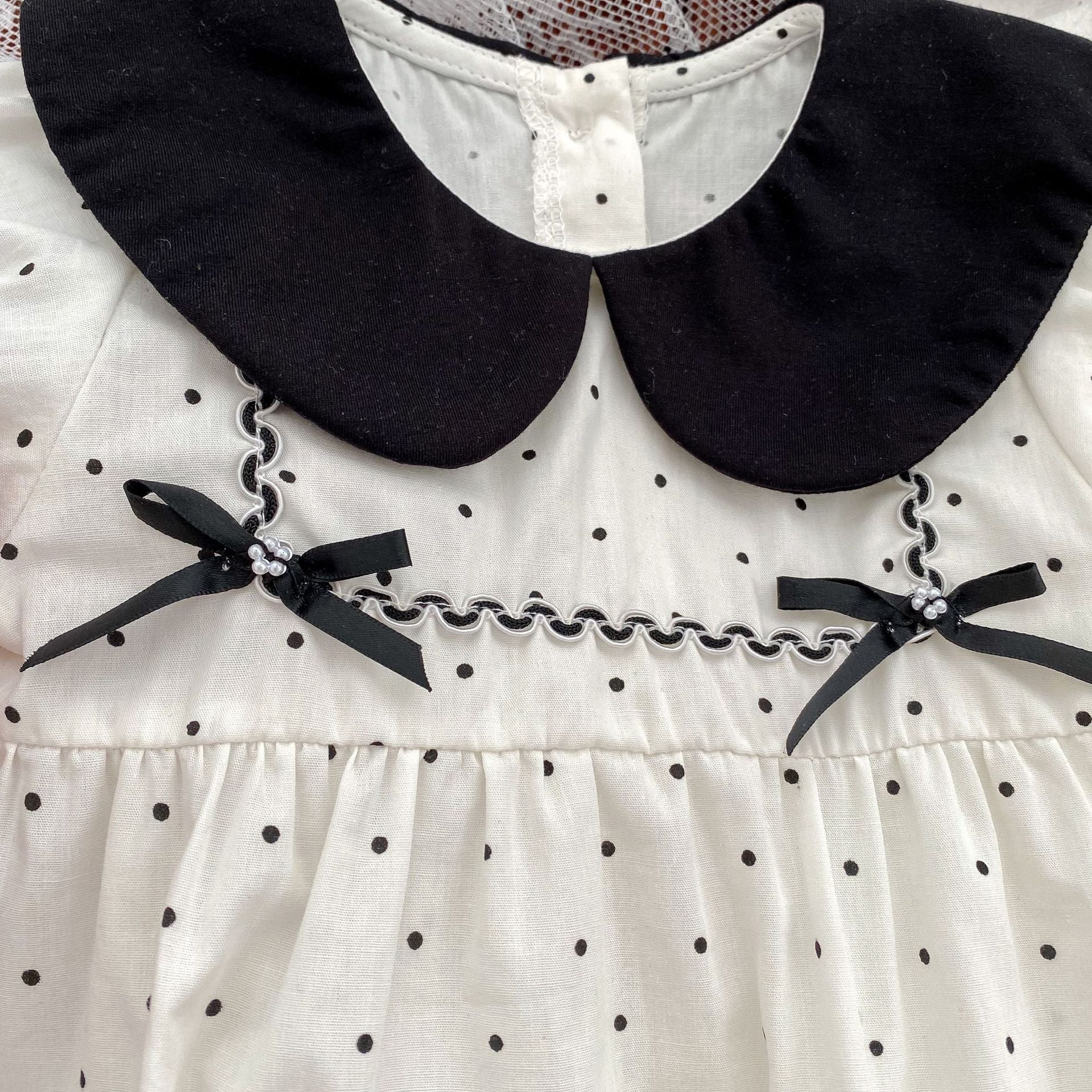 Baby girl polka dot bodysuit in soft white summer cotton with a stylish doll neck — view 4