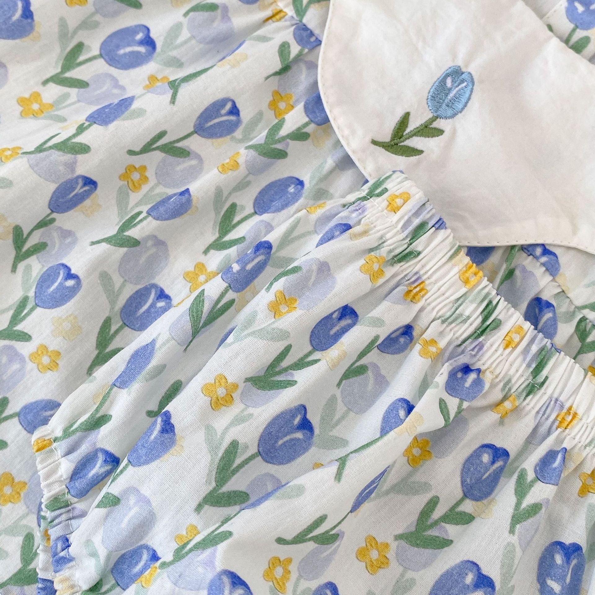 Blue cotton baby clothing set with floral embroidered doll neck top and matching shorts — view 5