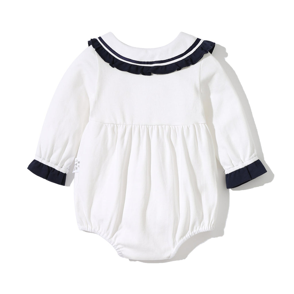 Baby girl sailor bodysuit in white and navy blue with a playful tie-dye patched design — view 5