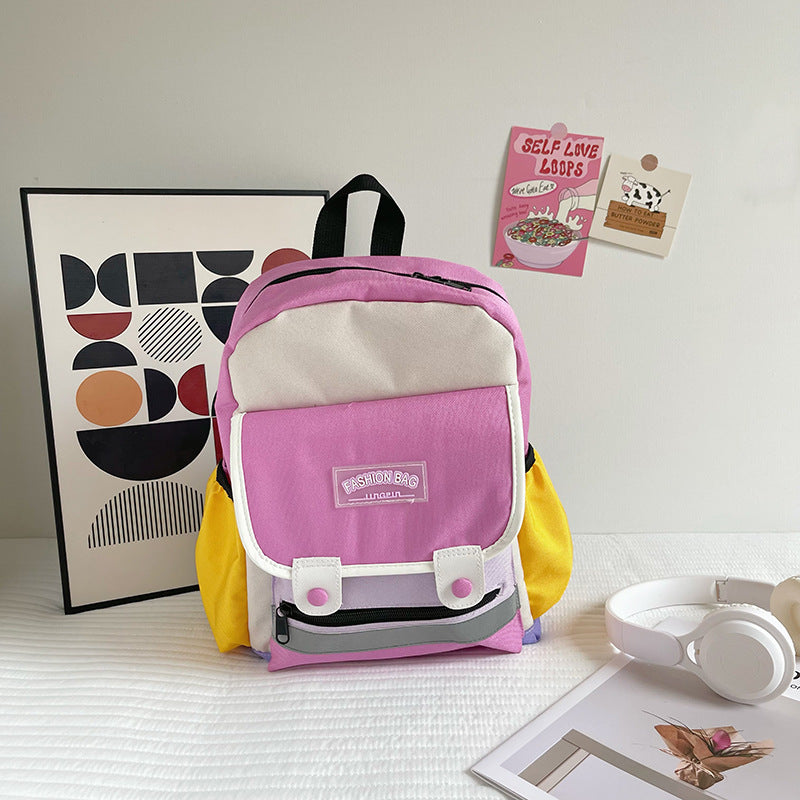 Preschool canvas backpack for children featuring a colorful patchwork design and spacious main storage compartment — view 4