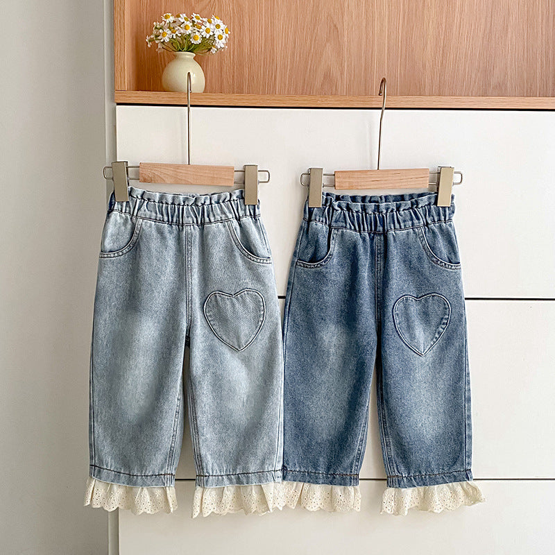 Girls lace patchwork denim pants with heart pattern and color-blocking in light blue cotton blend.