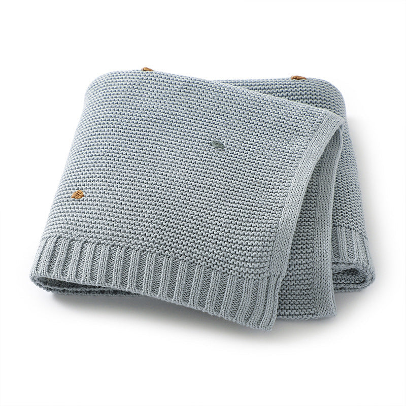 Knitted cotton baby blanket with hand-embroidered pom poms, in soft solid colors for contemporary nurseries. — view 4