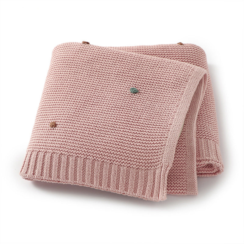 Knitted cotton baby blanket with hand-embroidered pom poms, in soft solid colors for contemporary nurseries. — view 5