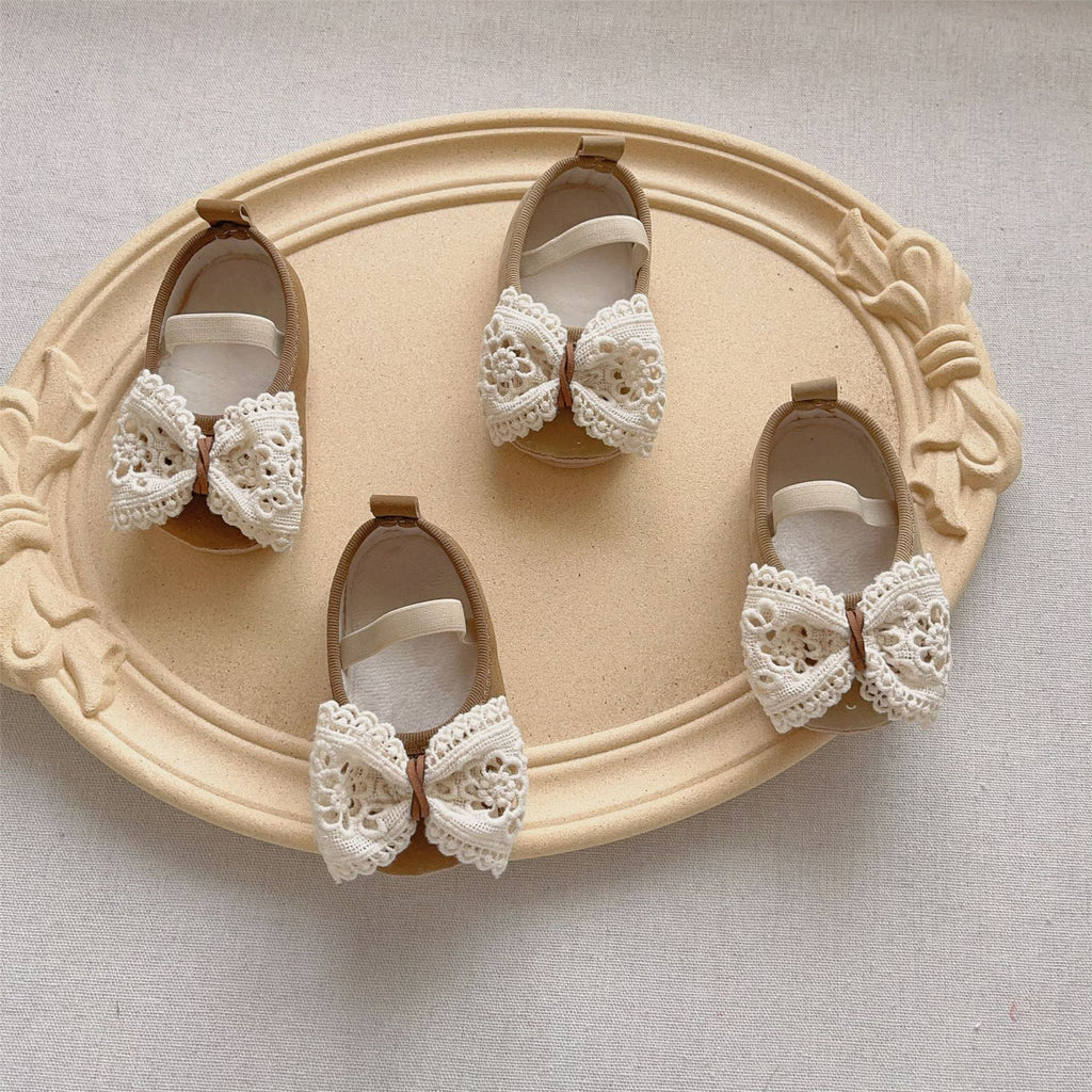 Beige and coffee baby girl toddler walking shoes with a sweet bow and hollow-out design