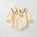 Apricot teddy bear baby bodysuit with classic collar in a soft cotton blend for autumn