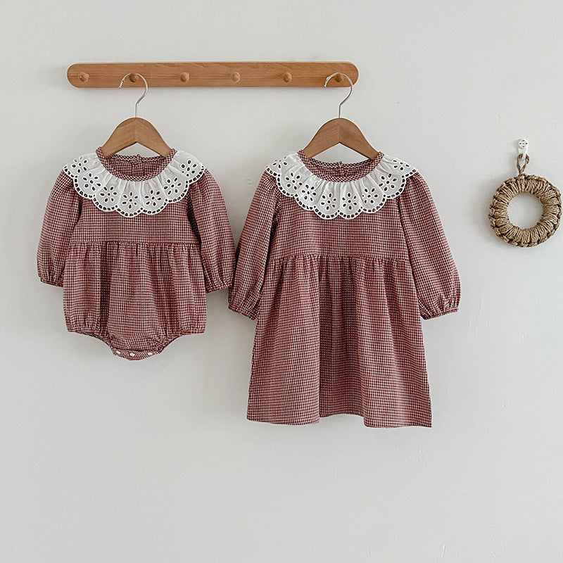 Red and brown plaid long sleeve baby bodysuit dress featuring a white fashion lace collar.