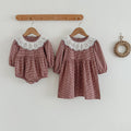 Red and brown plaid long sleeve baby bodysuit dress featuring a white fashion lace collar.