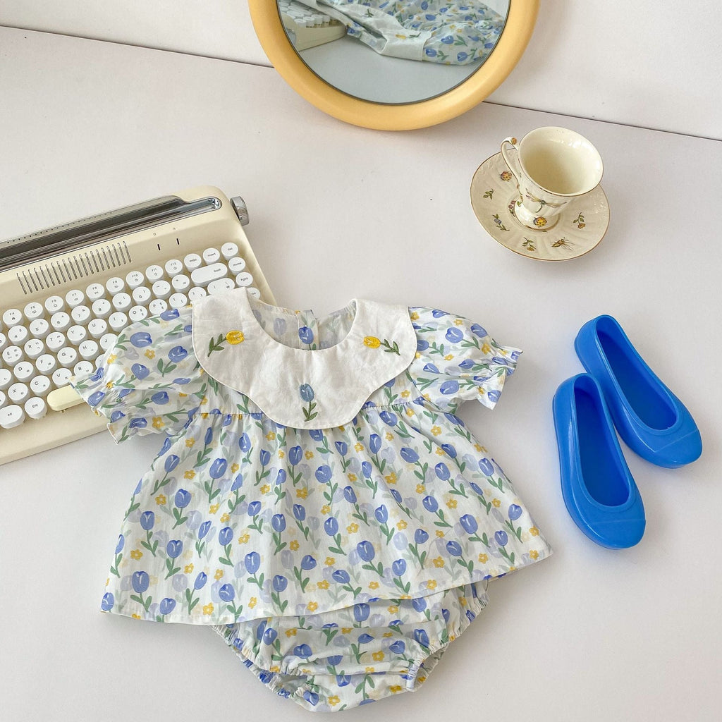 Blue cotton baby clothing set with floral embroidered doll neck top and matching shorts