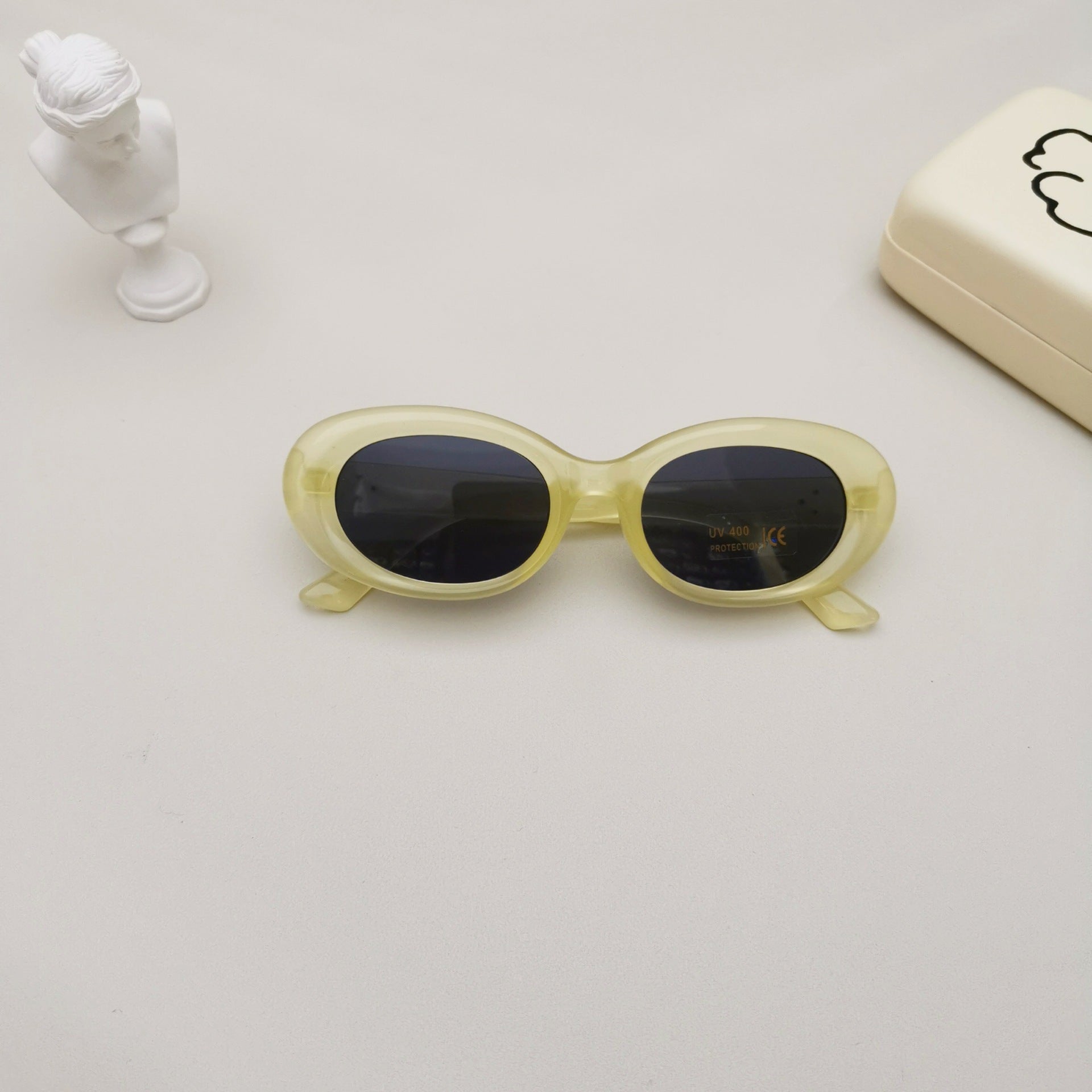 Kids oval beach sunglasses in solid colors featuring lightweight polycarbonate frames and UV protective lenses — view 3