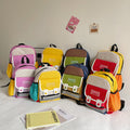 Preschool canvas backpack for children featuring a colorful patchwork design and spacious main storage compartment