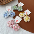Girls fabric checkered hair elastics with 3D flower accents in pink blue green and yellow