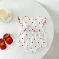 Baby girls beige summer bodysuit featuring a red heart print and delicate flutter fly sleeves.