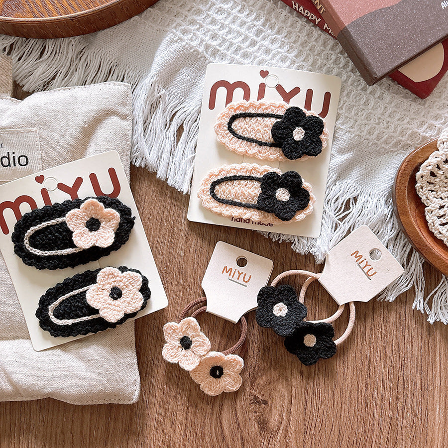 Knitted flower baby hair clips in soft cloth material for taming delicate stray hairs